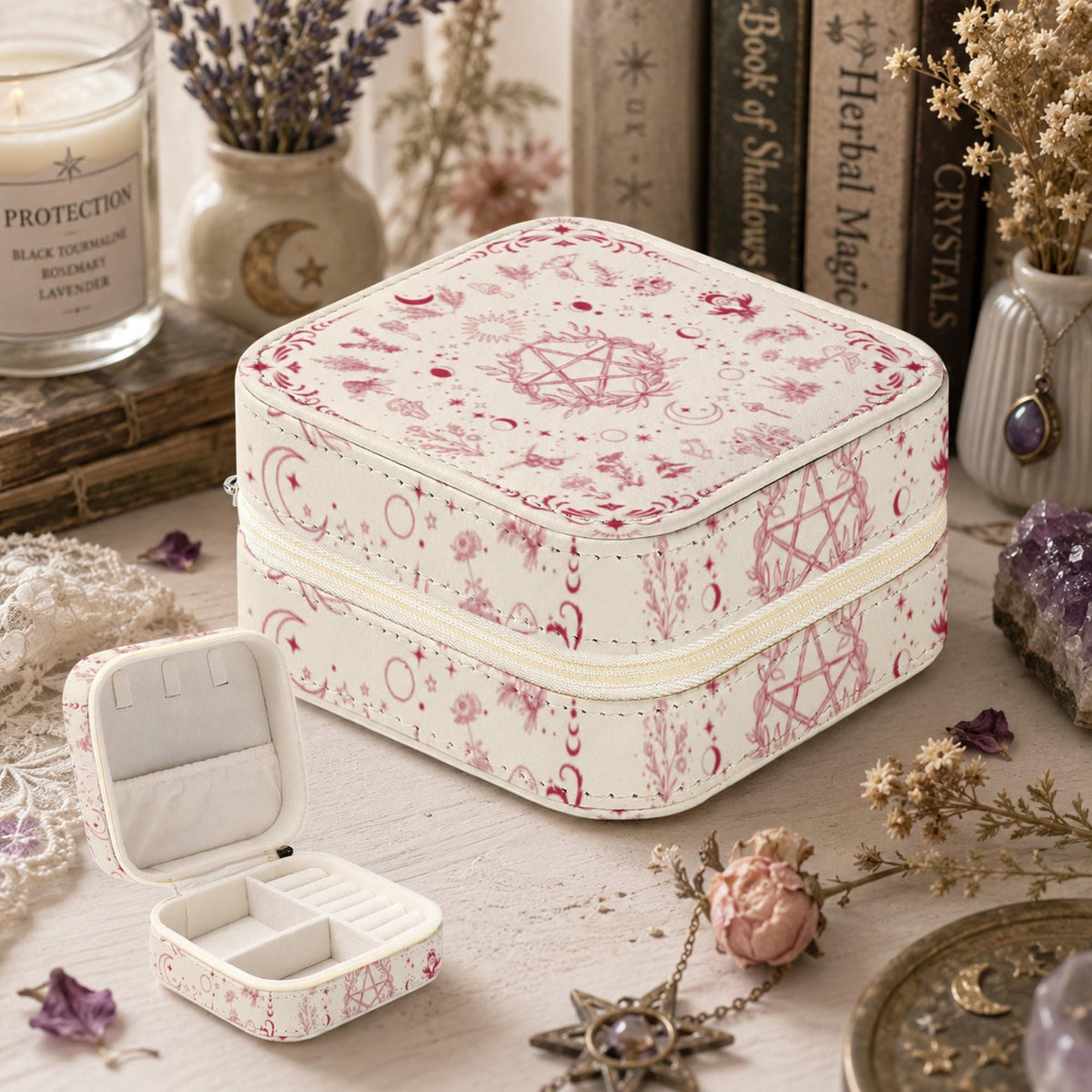 Angled view of a brown wooden jewelry box with a floral pentagram lid beside candles and crystals.