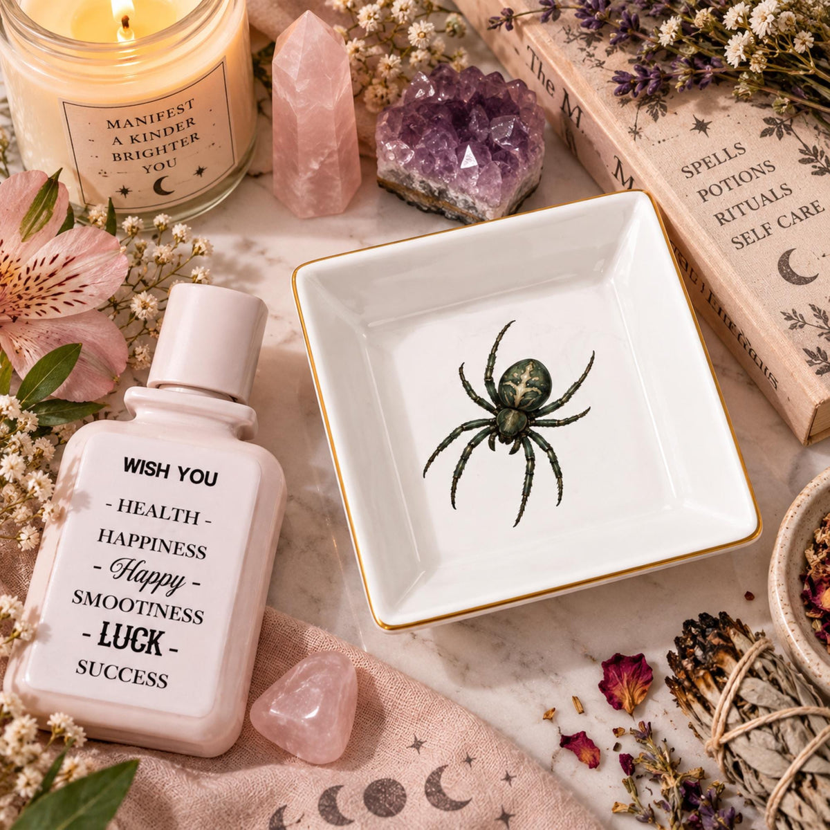Empty white square spider jewelry dish beside a pink lotion bottle and facial roller on a floral vanity.